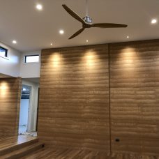 rammed earth wall lighting
